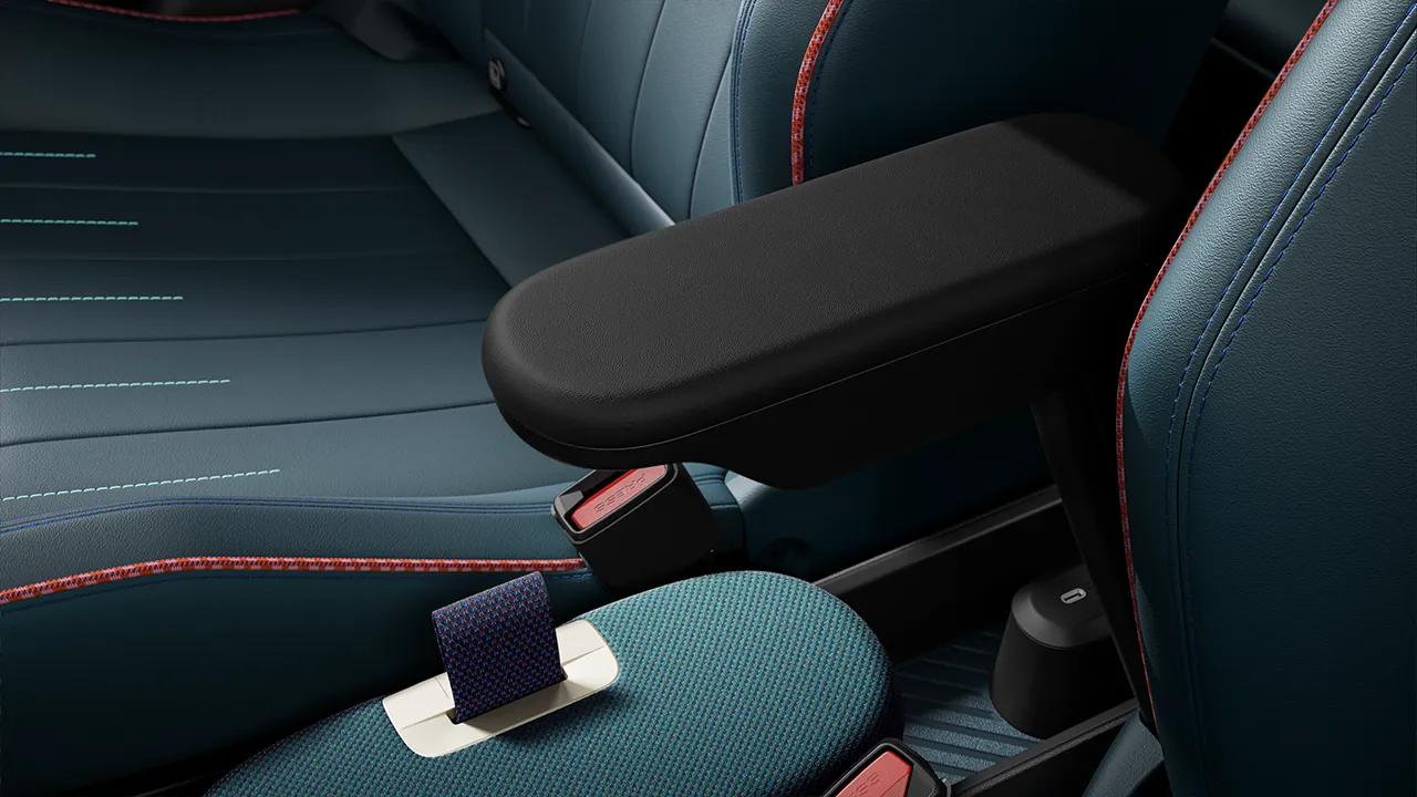 View of the all-electric MINI Aceman black armrest with Blue/Red seats