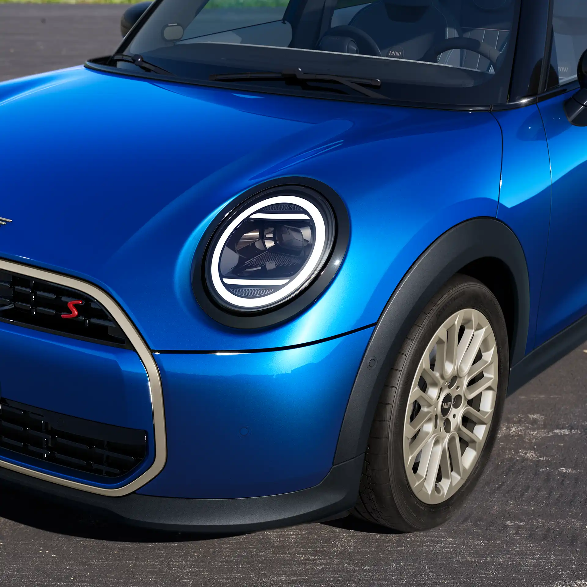 Front detail view of the MINI Cooper 5-Door showing design elements, headlights, and rims
