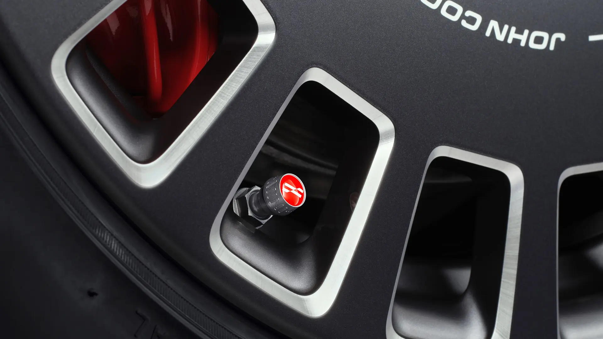 John Cooper Works aluminium valve caps for a stylish red visual accent on the tyre. 